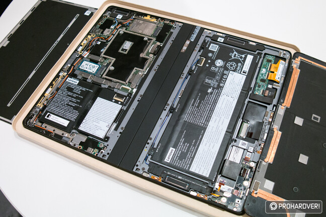 The back panel is fixed with adhesive strips, the SSD can be replaced on its own inside